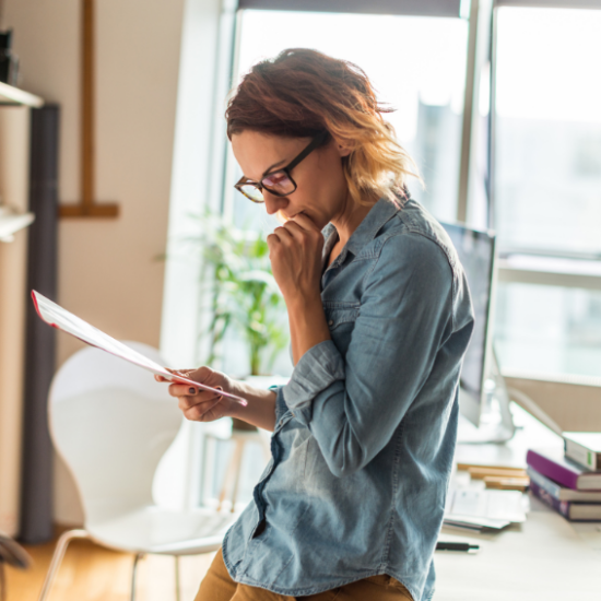 Lady reading documents IRS tax