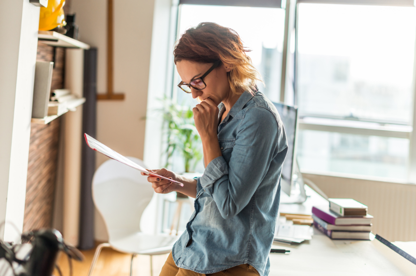 Lady reading documents IRS tax